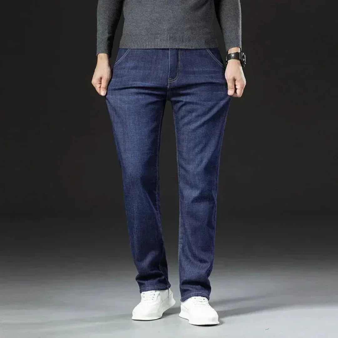 Men's straight-leg jeans in blue denim with sherpa-lined interior for cold-weather warmth