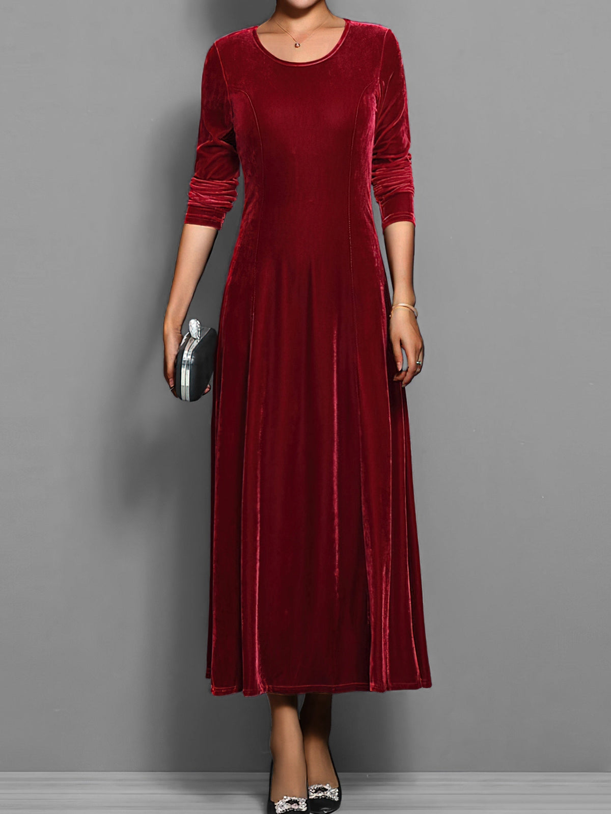 Soft velvet midi dress in rich jewel tone with elegant drape and luxurious textured fabric