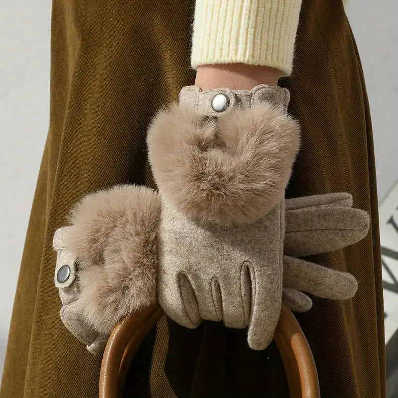 Black faux fur winter gloves with touchscreen-compatible fingertips and embroidered rabbit fur accents