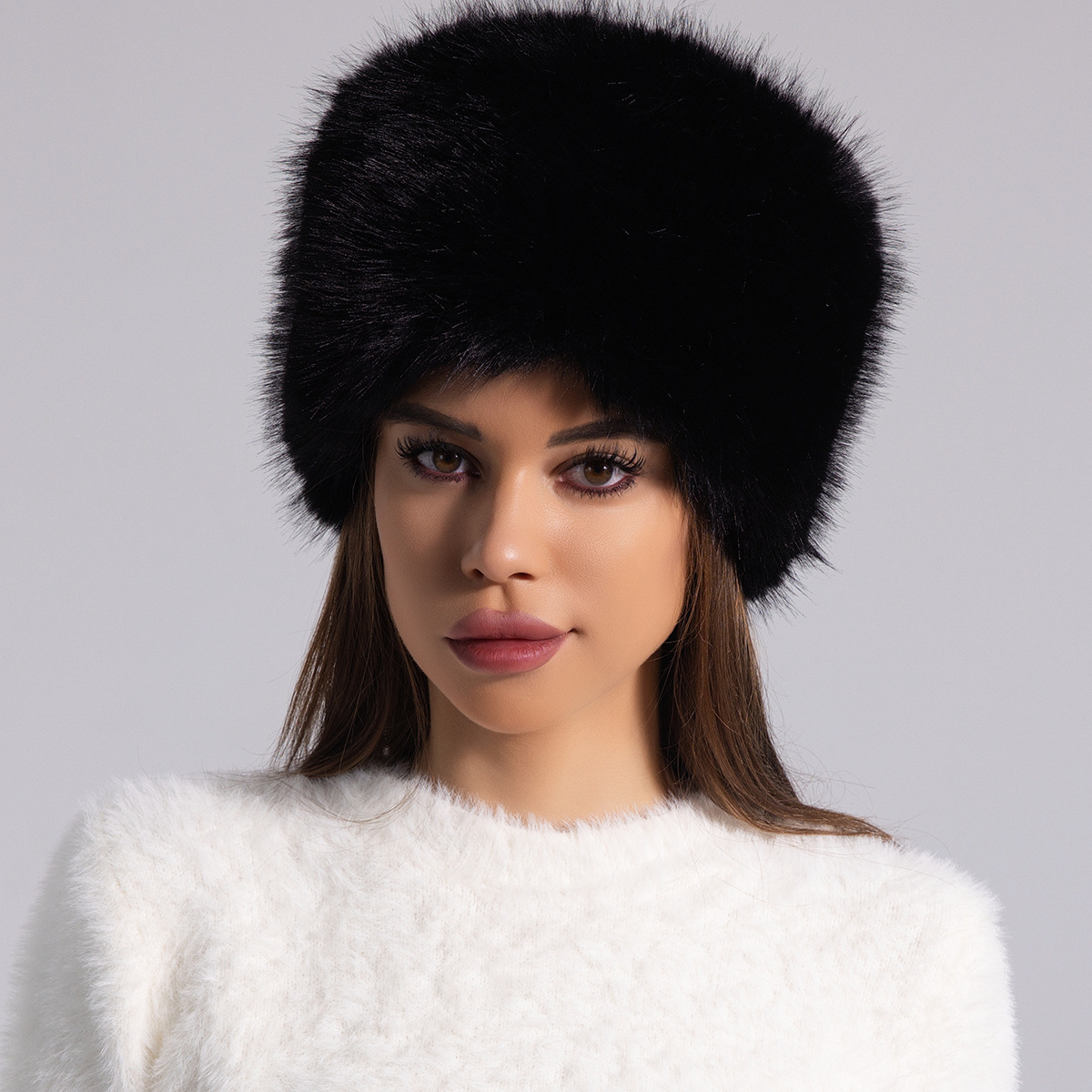 Women's solid furry round fur hat with full coverage silhouette for winter warmth