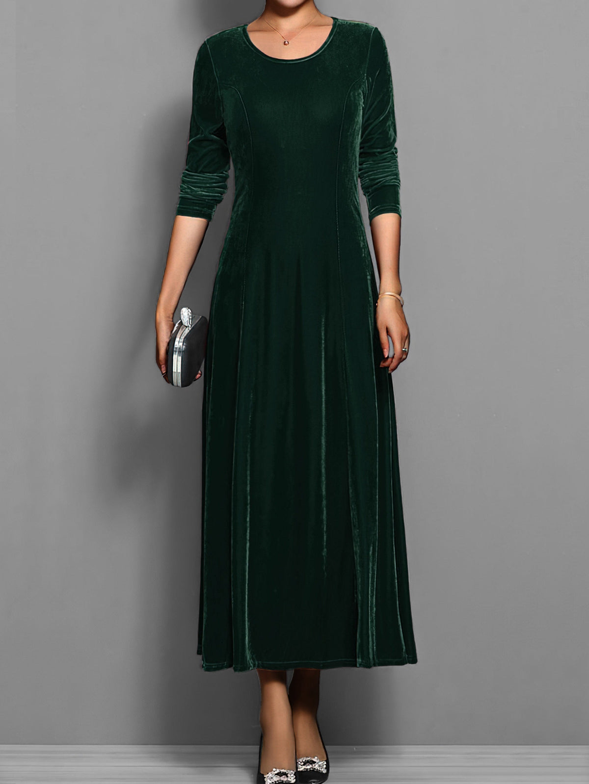 Soft velvet midi dress in rich jewel tone with elegant drape and luxurious texture