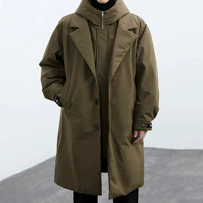 Oversized hooded trench coat in neutral tone with detachable hood and mid-thigh windbreaker silhouette