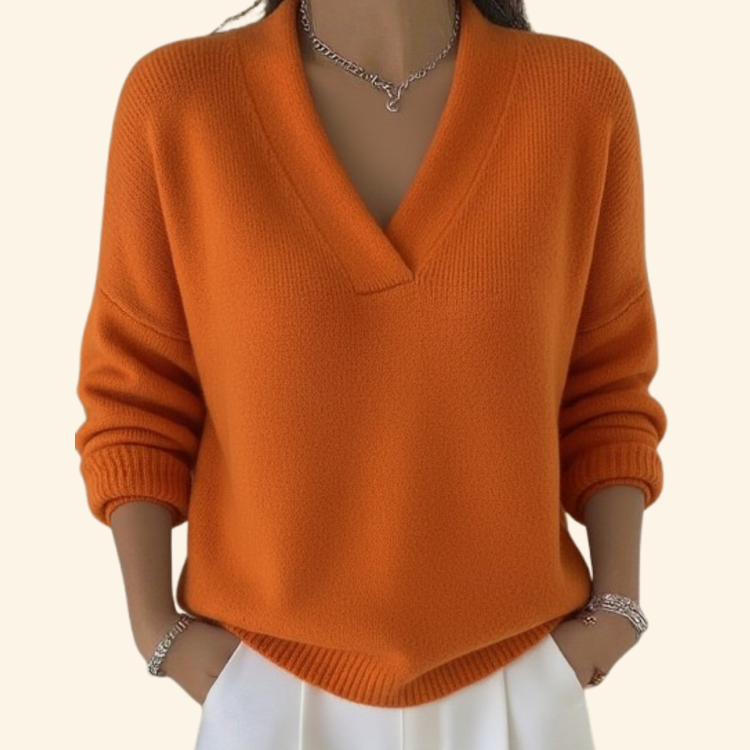 Relaxed V-neck knit sweater in soft neutral tone with lightweight breathable fabric and flattering loose silhouette