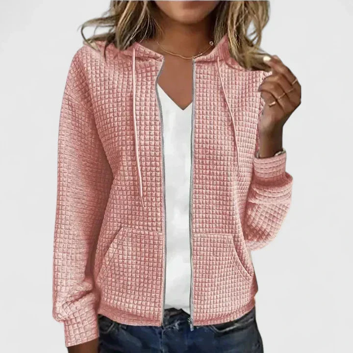 Elegant relaxed-fit cardigan in soft neutral tones with breathable fabric and flattering silhouette