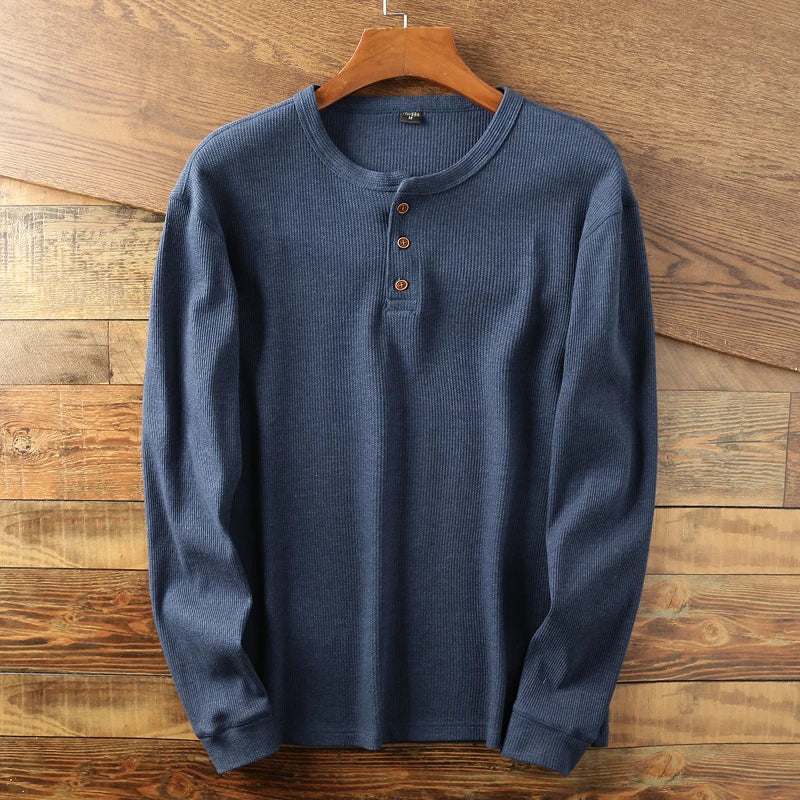 Beige waffle knit Henley long sleeve shirt with minimalist design and double-stitched details