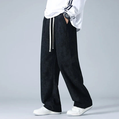 Azure blue corduroy sweatpants with relaxed wide-leg fit and utility pockets