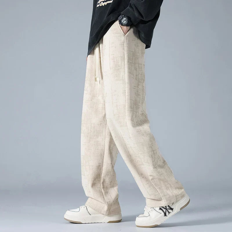 Azure blue corduroy sweatpants with relaxed wide-leg fit and utility pockets
