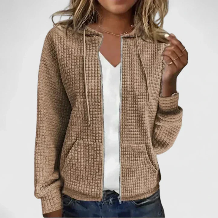 Elegant relaxed-fit cardigan in soft neutral tones with breathable fabric and flattering silhouette