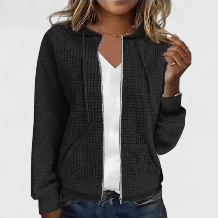 Elegant relaxed-fit cardigan in soft neutral tones with breathable fabric and flattering silhouette