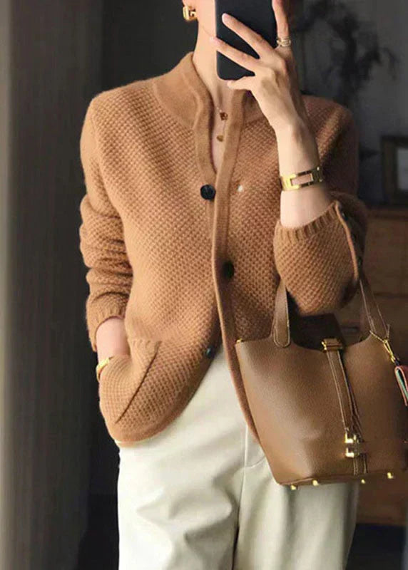 Elegant cream button-down cardigan with classic silhouette and refined button detail