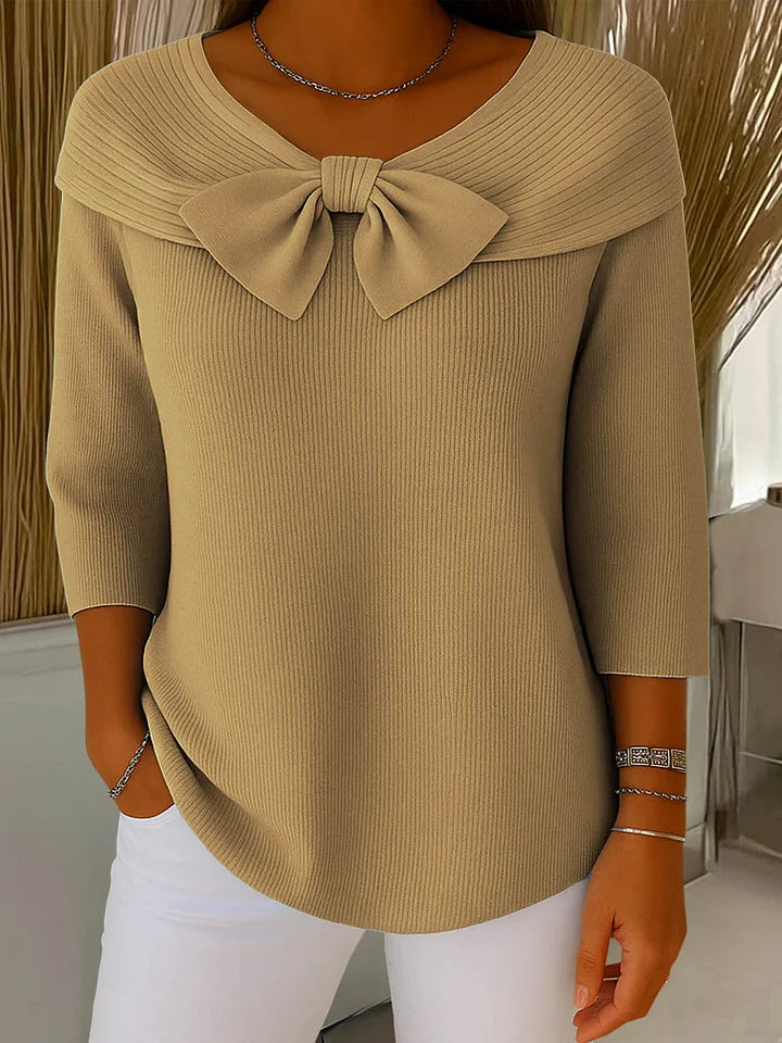 Soft feminine sweater with delicate bow accent detail, elegant chic style in violet hue