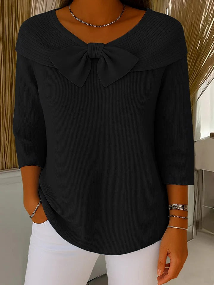 Women's round neck sweater with delicate bow accent, soft breathable knit, feminine elegant style