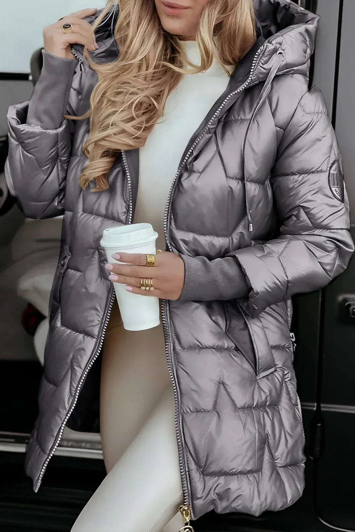 Black Raven tailored winter coat with sleek contemporary silhouette and cozy insulated design